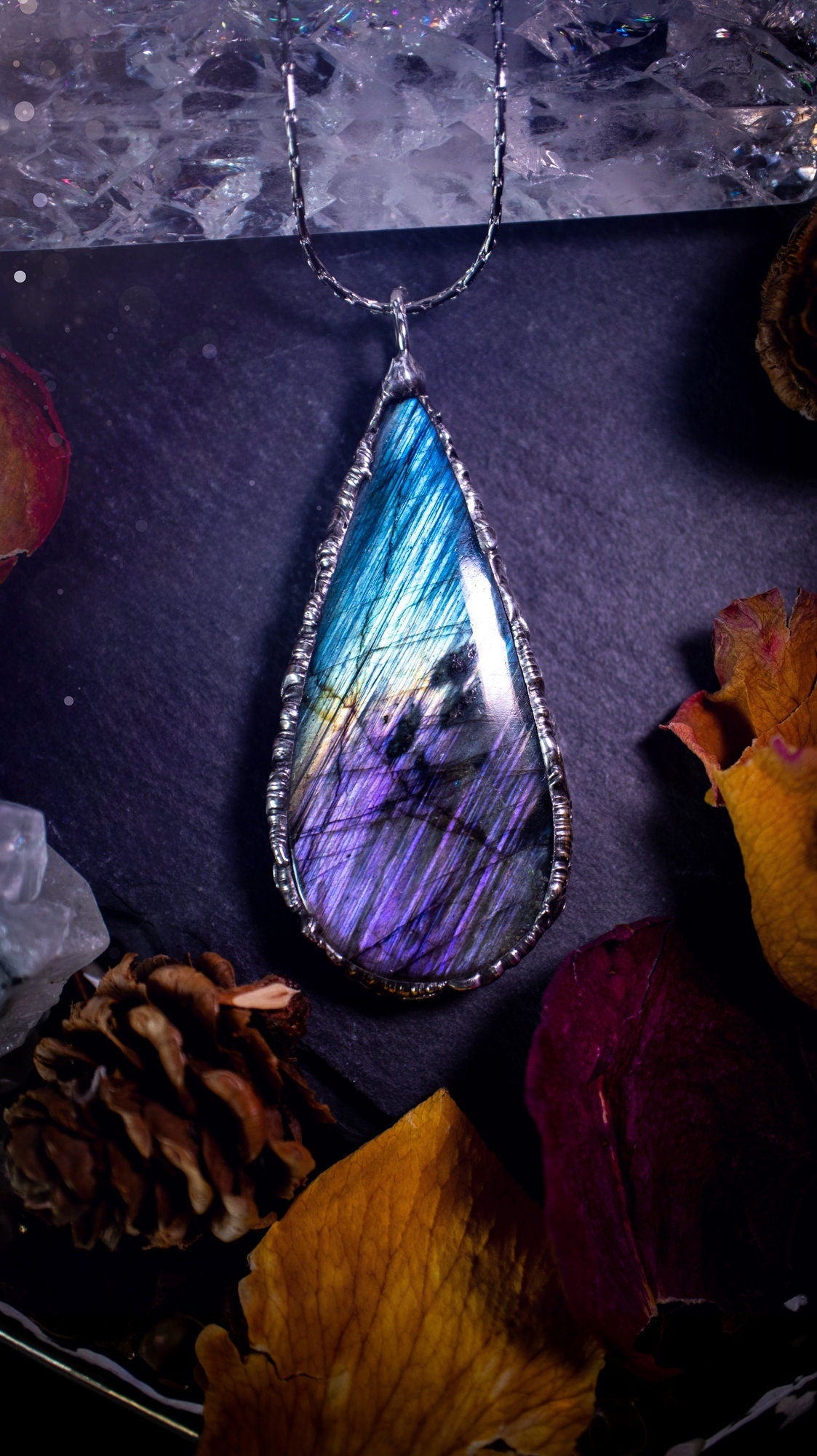 Beautiful, blue and purple labradorite crystal which has been soft soldered to create a stunning pendant. Natural crystal gemstone with lead free solder, a beautiful gift for any crystal lover. This piece of jewellery can be used for healing. Gothic