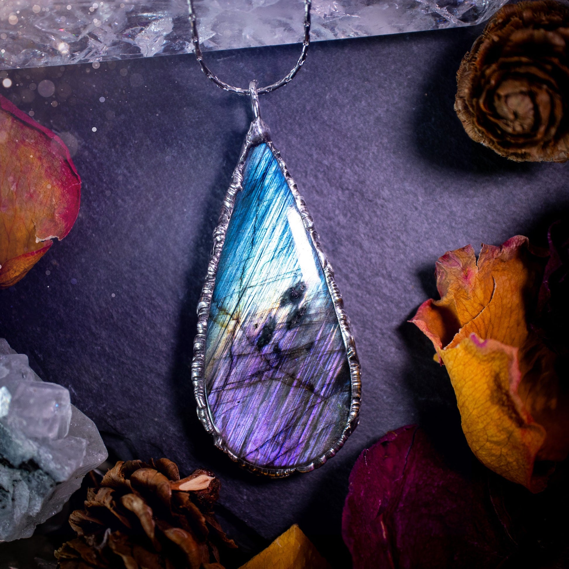 Beautiful, blue and purple labradorite crystal which has been soft soldered to create a stunning pendant. Natural crystal gemstone with lead free solder, a beautiful gift for any crystal lover. This piece of jewellery can be used for healing. Gothic