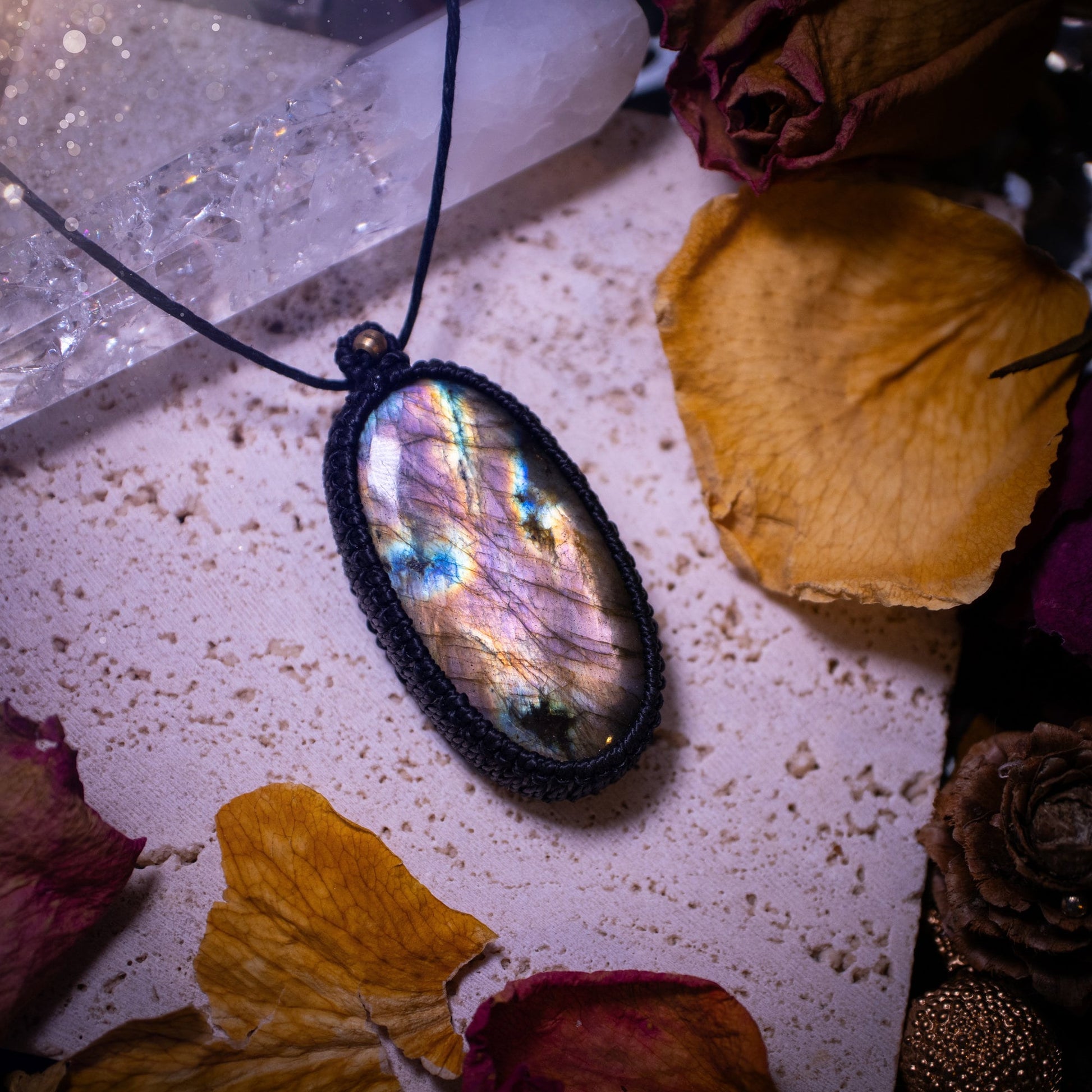 Handcrafted, purple and pink, labradorite spectrolite pendant necklace. This piece of jewellery features a fairy tale crystal full of magical colours. Has been handmade using high quality Linhasita cord. Ideal gift for hippies and crystal lovers.