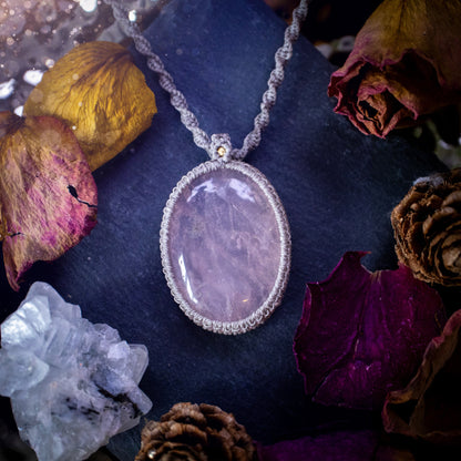 Handmade, natural rose quartz macrame pendant necklace. Featuring a beautiful Rose Quartz crystal which is full of inclusions and a little rainbow. Crafted with high quality linhastia wax cord, and accents on the necklace. Hippy gifts for her.