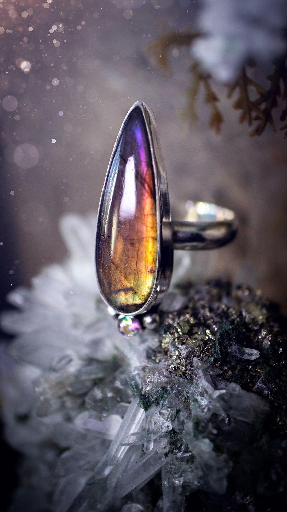 Stunning and handcrafted, natural purple labradorite sterling silver statement ring. This beautiful ring has been made from recycled sterling silver and has a smooth ring shank. Size N. Ideal for crystal and jewellery lovers. Hippy and witch jewelry.