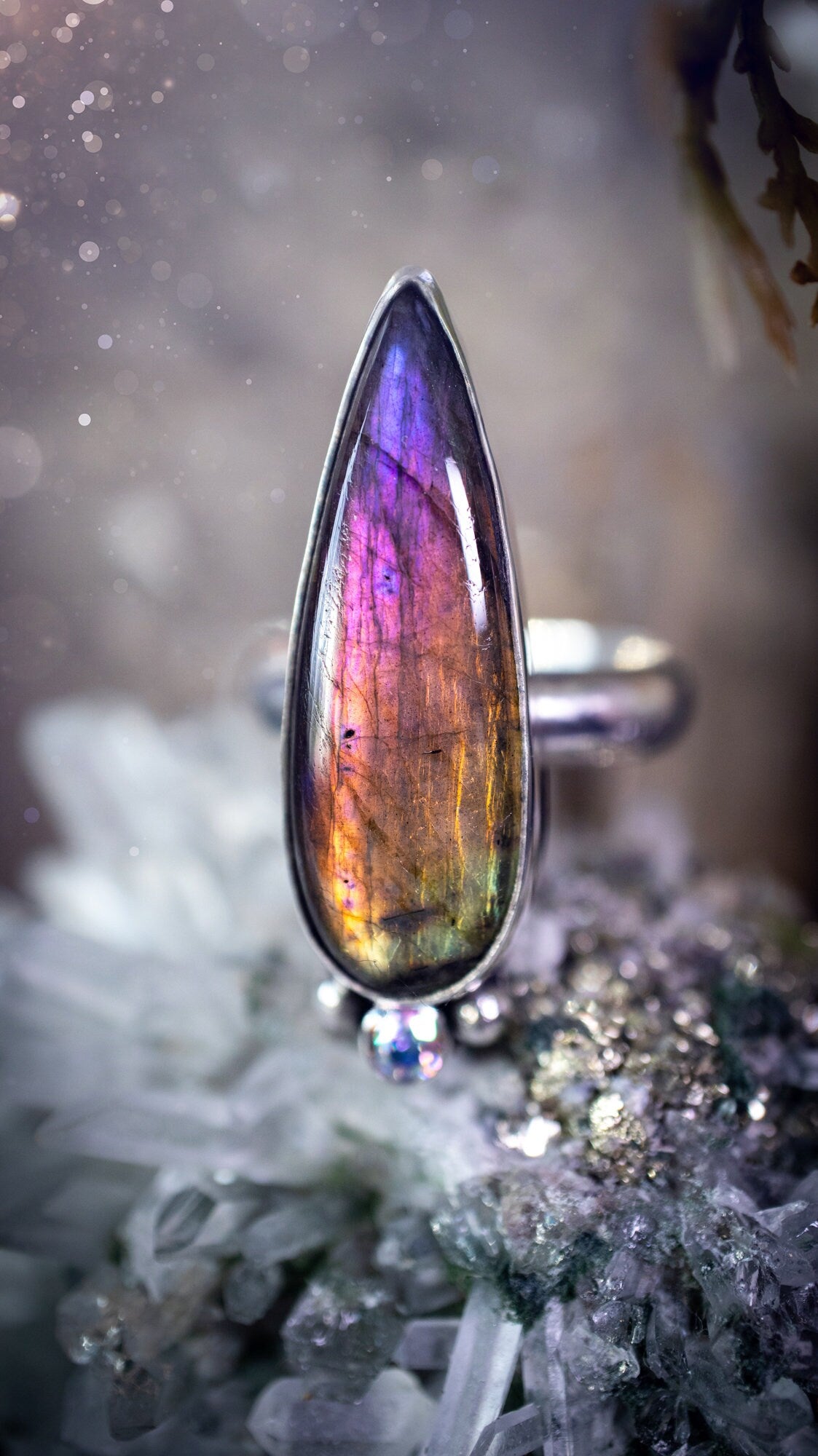 Stunning and handcrafted, natural purple labradorite sterling silver statement ring. This beautiful ring has been made from recycled sterling silver and has a smooth ring shank. Size N. Ideal for crystal and jewellery lovers. Hippy and witch jewelry.