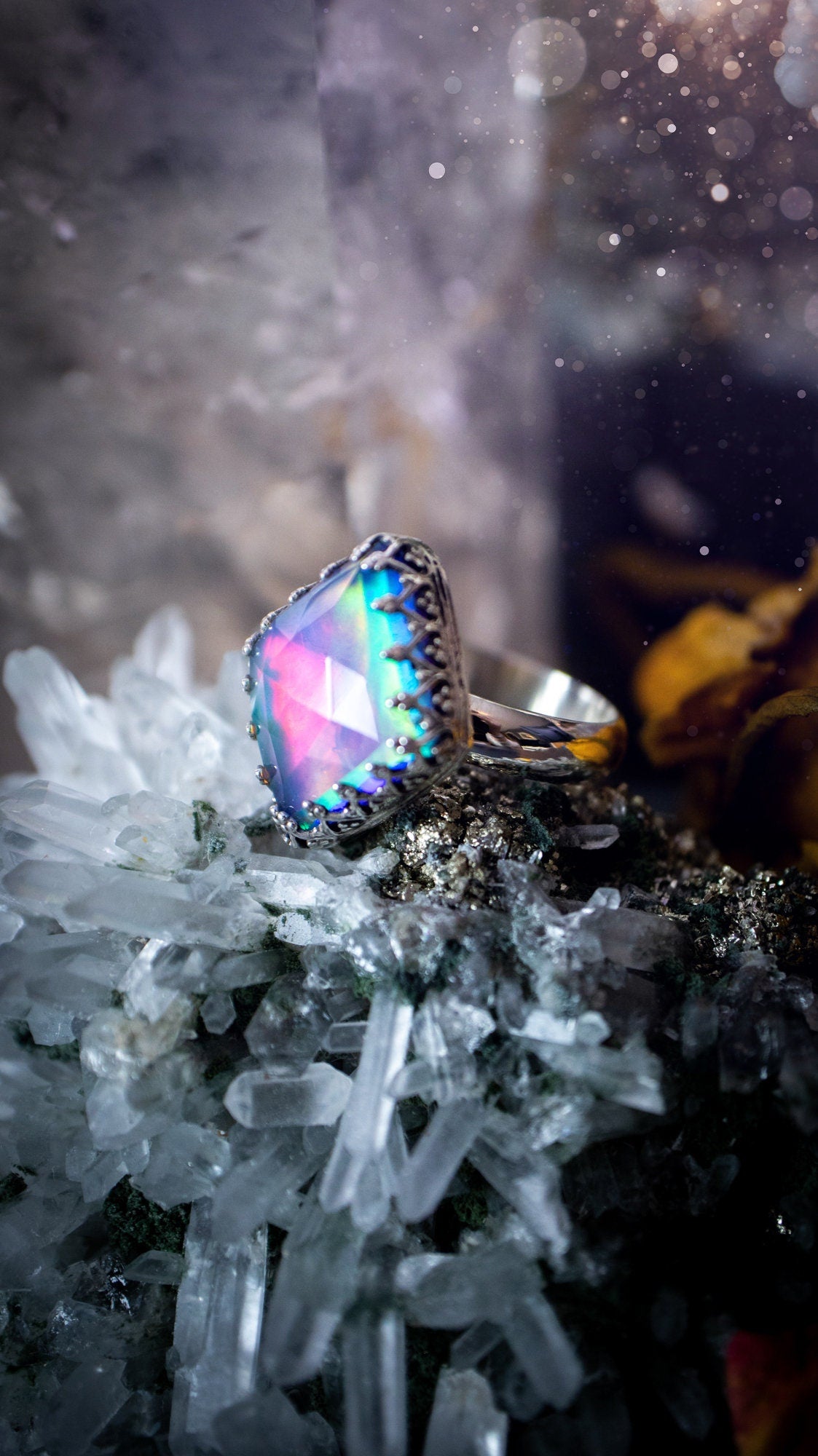 Truly unique and regal, sterling silver, aurora opal stacking ring. This ring has been handmade with a very colourful aurora opal that is full of pinks, greens and blues. Mounted on a plain ring shank, featuring regal gallery bezel around the gem