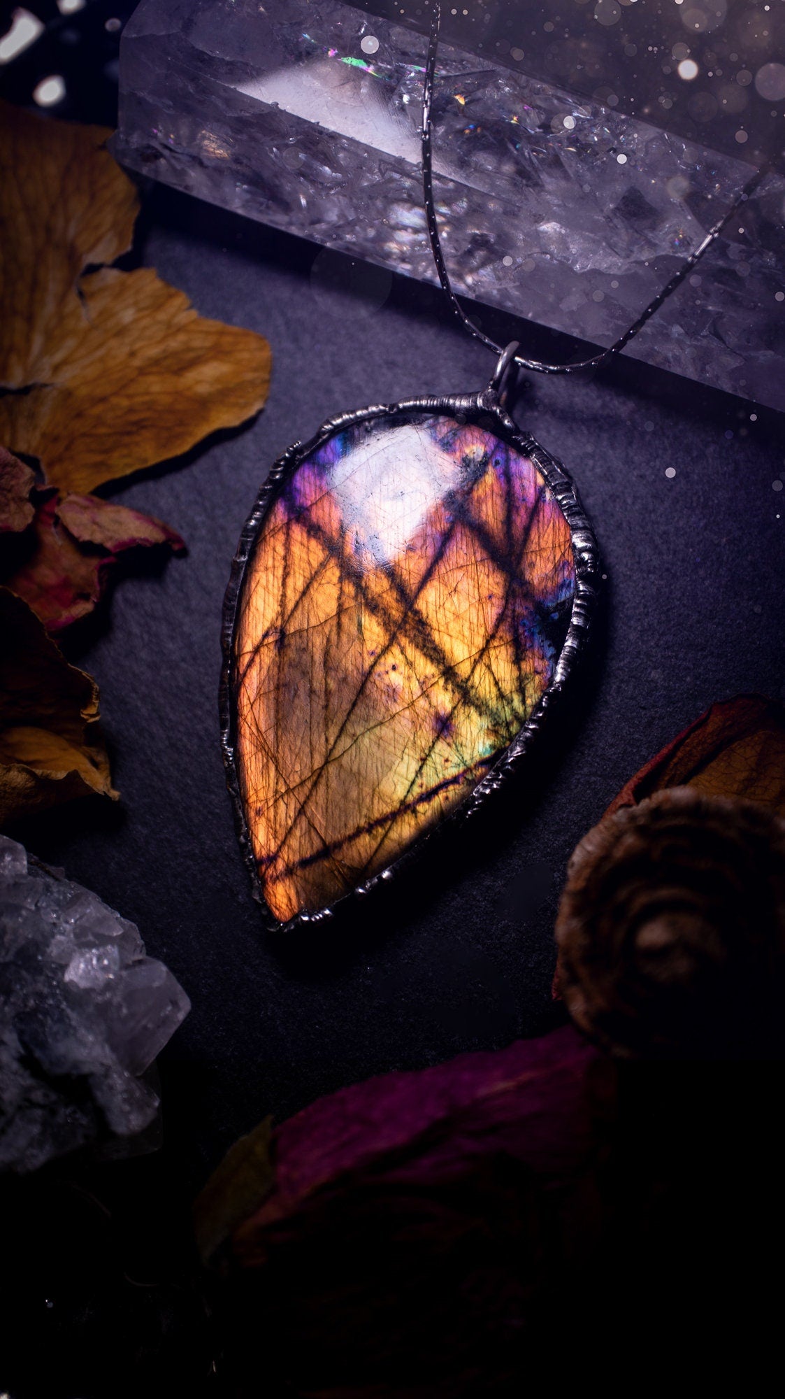 Beautiful, orange, pink and purple labradorite crystal which has been soft soldered to create a stunning pendant. Natural crystal gemstone with lead free solder, a beautiful gift for any crystal lover. This piece of jewellery can be used for healing