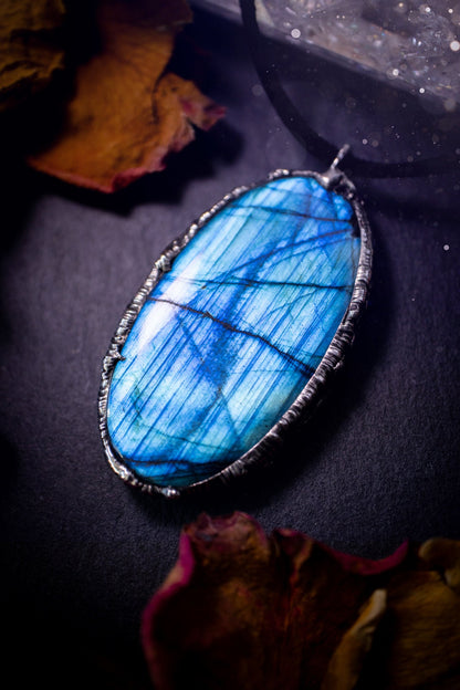 Beautiful, flashy blue labradorite crystal which has been soft soldered to create a stunning pendant. Natural crystal gemstone with lead free solder, a beautiful gift for any crystal lover. This piece of jewellery can be used for healing purposes.