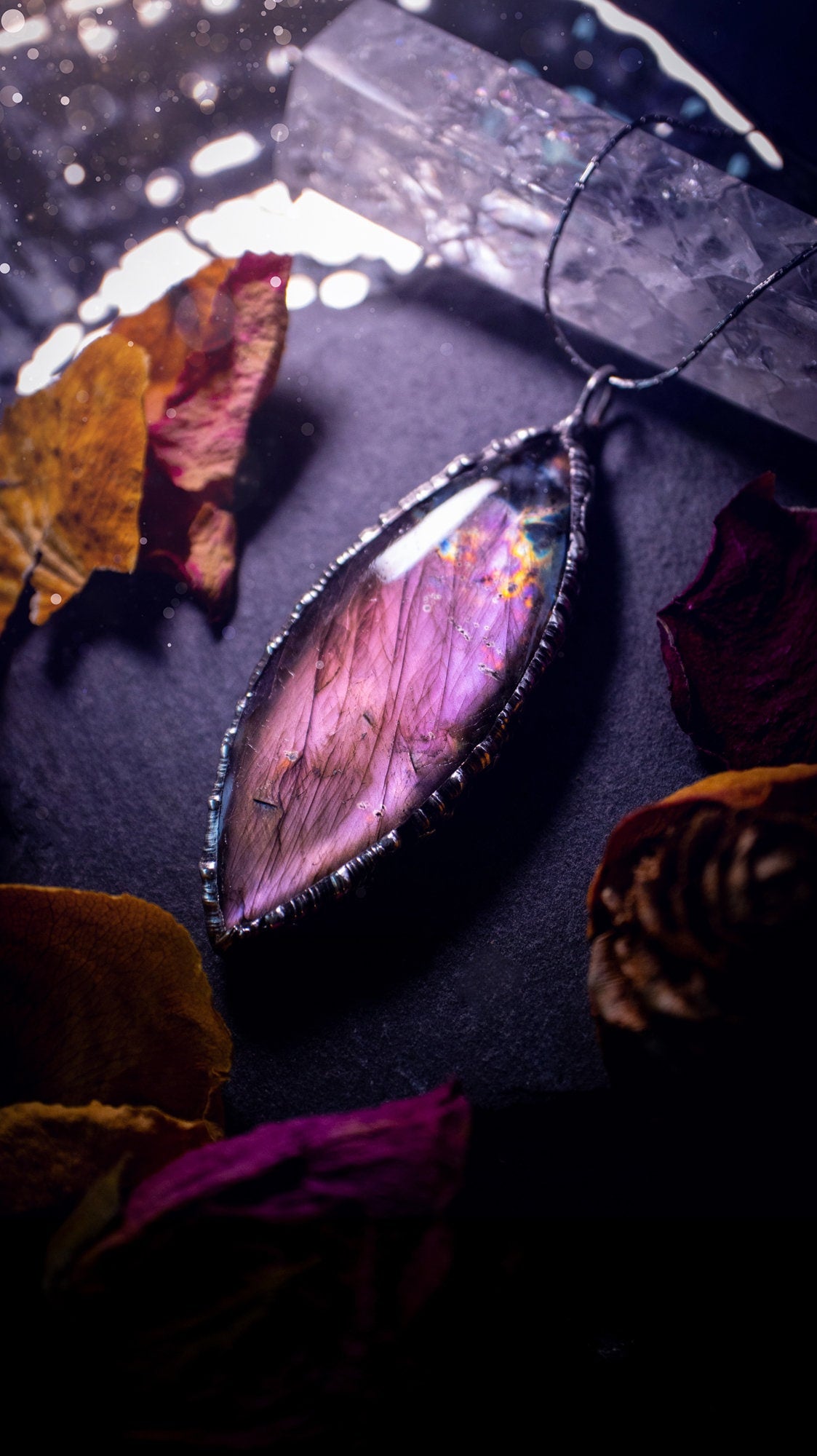 Beautiful, orange, pink and purple labradorite crystal which has been soft soldered to create a stunning pendant. Natural crystal gemstone with lead free solder, a beautiful gift for any crystal lover. This piece of jewellery can be used for healing