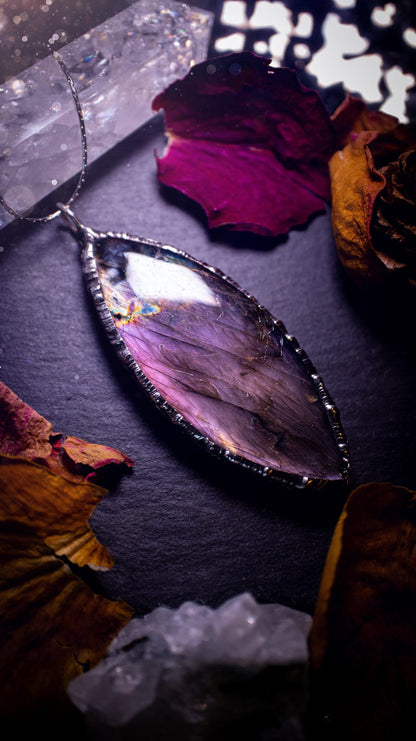 Beautiful, orange, pink and purple labradorite crystal which has been soft soldered to create a stunning pendant. Natural crystal gemstone with lead free solder, a beautiful gift for any crystal lover. This piece of jewellery can be used for healing