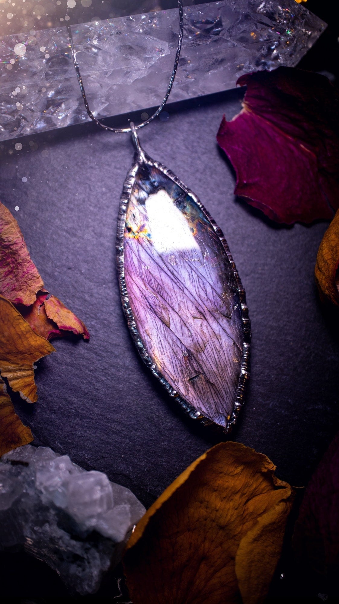 Beautiful, orange, pink and purple labradorite crystal which has been soft soldered to create a stunning pendant. Natural crystal gemstone with lead free solder, a beautiful gift for any crystal lover. This piece of jewellery can be used for healing