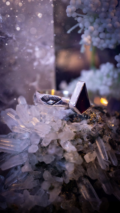 Beautiful and bold, garnet statement ring. Although this ring is dainty, it will certainly make a statement. Featuring a lovely red garnet crystal which is step cut, and mounted in sterling silver on a stamped ring band. Ideal crystal gifts for her