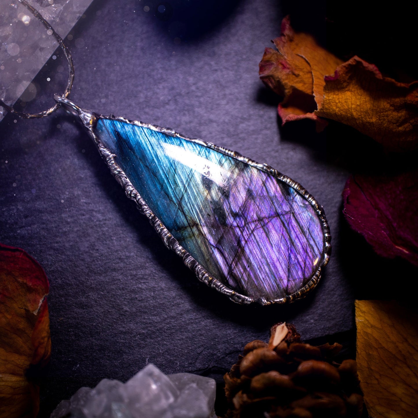 Beautiful, blue and purple labradorite crystal which has been soft soldered to create a stunning pendant. Natural crystal gemstone with lead free solder, a beautiful gift for any crystal lover. This piece of jewellery can be used for healing. Gothic