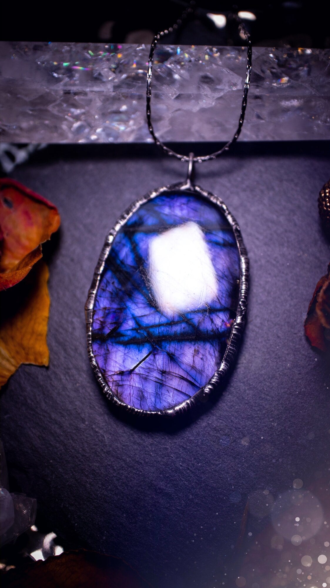 One of a kind, dark and mystical, deep purple flash, labradorite spectrolite crystal pendant necklace. Handmade using the soft solder technique, also known as the tiffany technique. Ideal gifts for both genders and crystal lovers. Witchy and gothic.