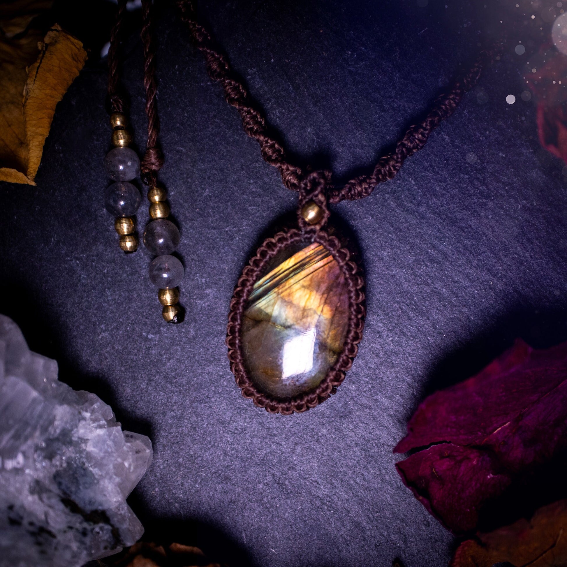 Handmade, autumn coloured labradorite macrame pendant necklace. Featuring a beautiful labradorite crystal which is full of orange, yellow and purple colours. Crafted with high quality linhastia wax cord, and accents on the necklace. Hippy gifts