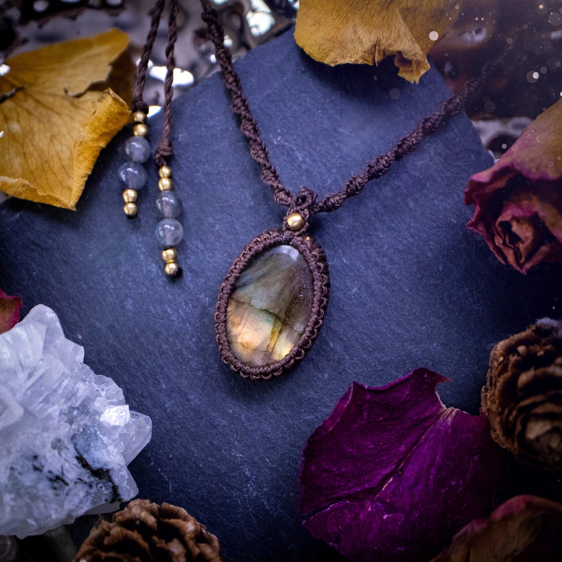 Handmade, autumn coloured labradorite macrame pendant necklace. Featuring a beautiful labradorite crystal which is full of orange, yellow and purple colours. Crafted with high quality linhastia wax cord, and accents on the necklace. Hippy gifts