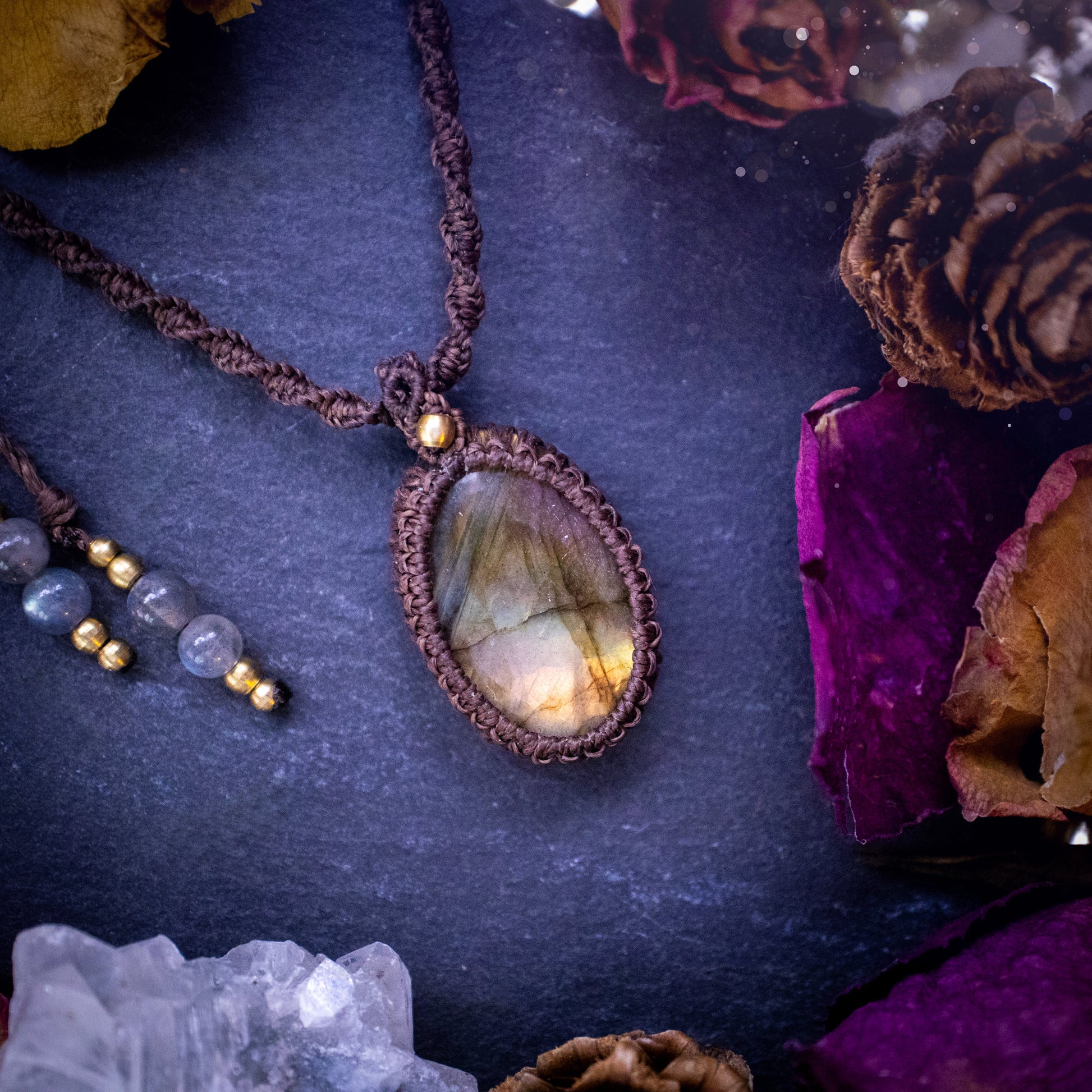 Handmade, autumn coloured labradorite macrame pendant necklace. Featuring a beautiful labradorite crystal which is full of orange, yellow and purple colours. Crafted with high quality linhastia wax cord, and accents on the necklace. Hippy gifts