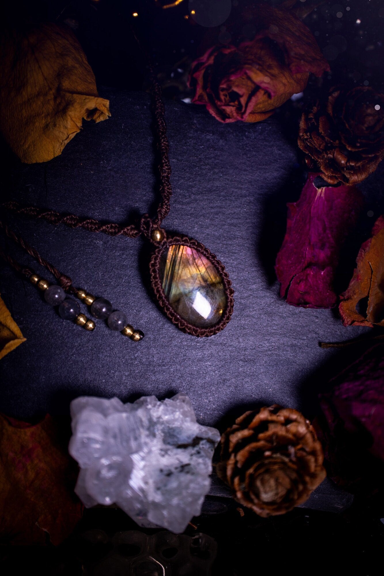 Handmade, autumn coloured labradorite macrame pendant necklace. Featuring a beautiful labradorite crystal which is full of orange, yellow and purple colours. Crafted with high quality linhastia wax cord, and accents on the necklace. Hippy gifts