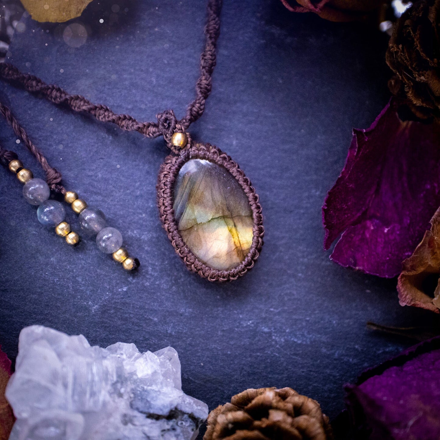 Handmade, autumn coloured labradorite macrame pendant necklace. Featuring a beautiful labradorite crystal which is full of orange, yellow and purple colours. Crafted with high quality linhastia wax cord, and accents on the necklace. Hippy gifts