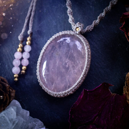 Handmade, natural rose quartz macrame pendant necklace. Featuring a beautiful Rose Quartz crystal which is full of inclusions and a little rainbow. Crafted with high quality linhastia wax cord, and accents on the necklace. Hippy gifts for her.