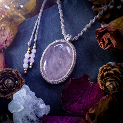 Handmade, natural rose quartz macrame pendant necklace. Featuring a beautiful Rose Quartz crystal which is full of inclusions and a little rainbow. Crafted with high quality linhastia wax cord, and accents on the necklace. Hippy gifts for her.