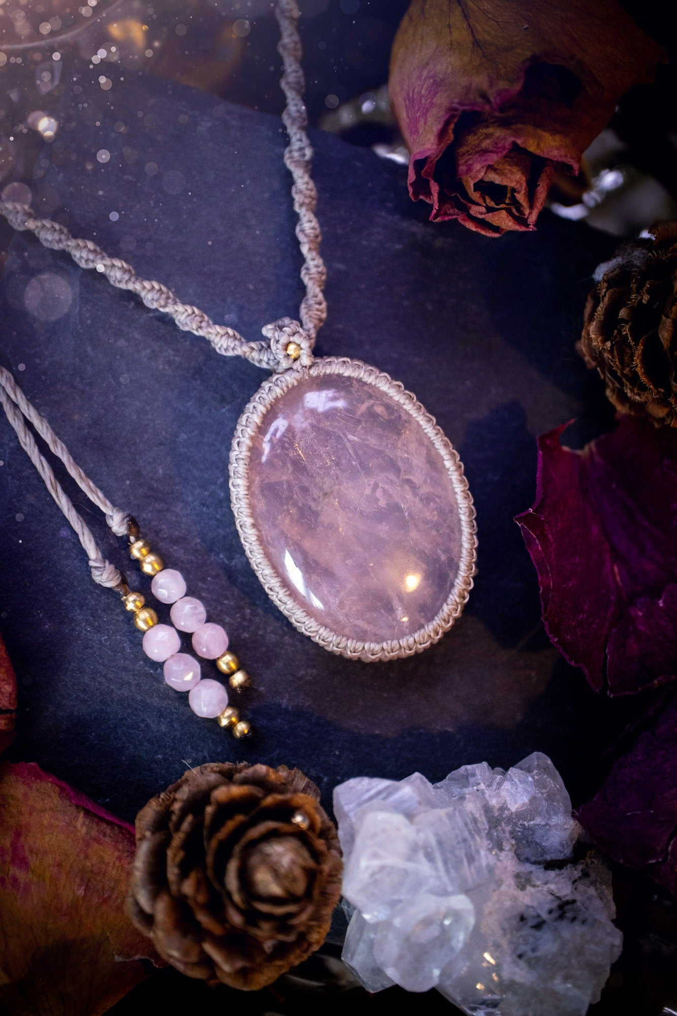 Handmade, natural rose quartz macrame pendant necklace. Featuring a beautiful Rose Quartz crystal which is full of inclusions and a little rainbow. Crafted with high quality linhastia wax cord, and accents on the necklace. Hippy gifts for her.