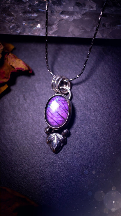 Gorgeous and dainty, sterling silver, deep purple flash, labradorite spectrolite pendant necklace. This beautiful necklace features a beautiful labradorite crystal full of colour. Handcrafted from sterling silver that has been recycled. Ideal gift.