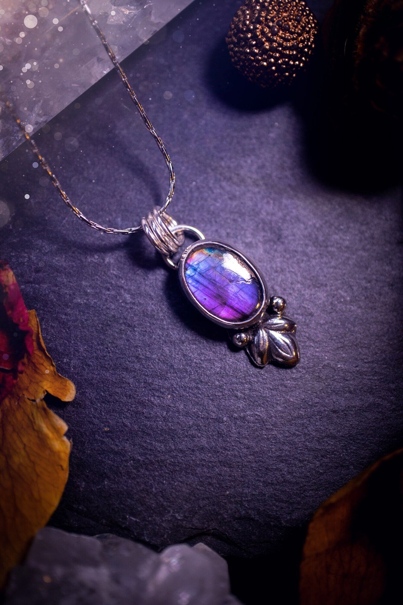 Gorgeous and dainty, sterling silver, deep purple flash, labradorite spectrolite pendant necklace. This beautiful necklace features a beautiful labradorite crystal full of colour. Handcrafted from sterling silver that has been recycled. Ideal gift.