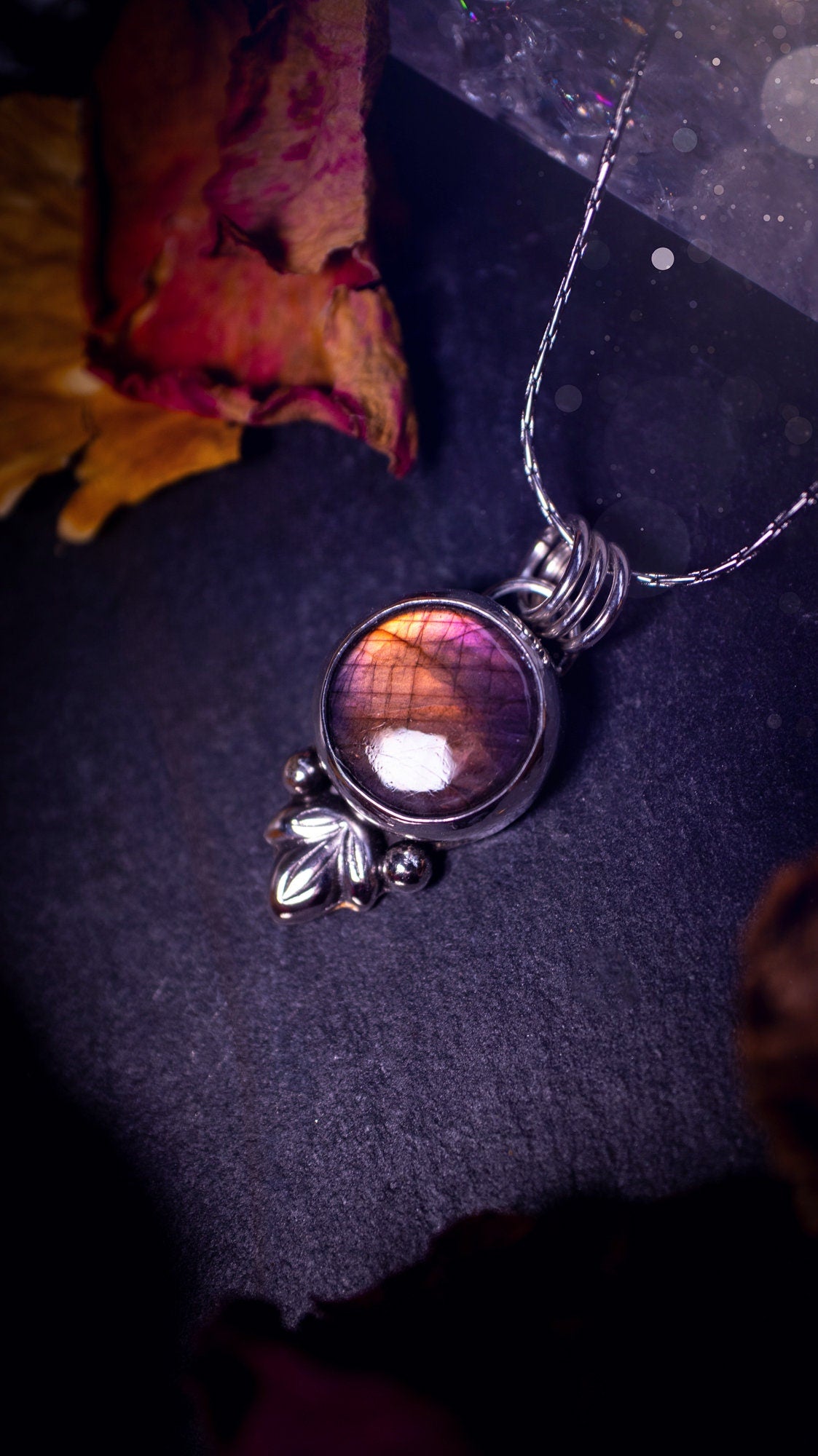 Gorgeous and handmade, sterling silver, purple and orange, labradorite spectrolite pendant necklace. This beautiful necklace features a beautiful labradorite crystal full of colour. Handcrafted from sterling silver that has been recycled. Ideal gift.