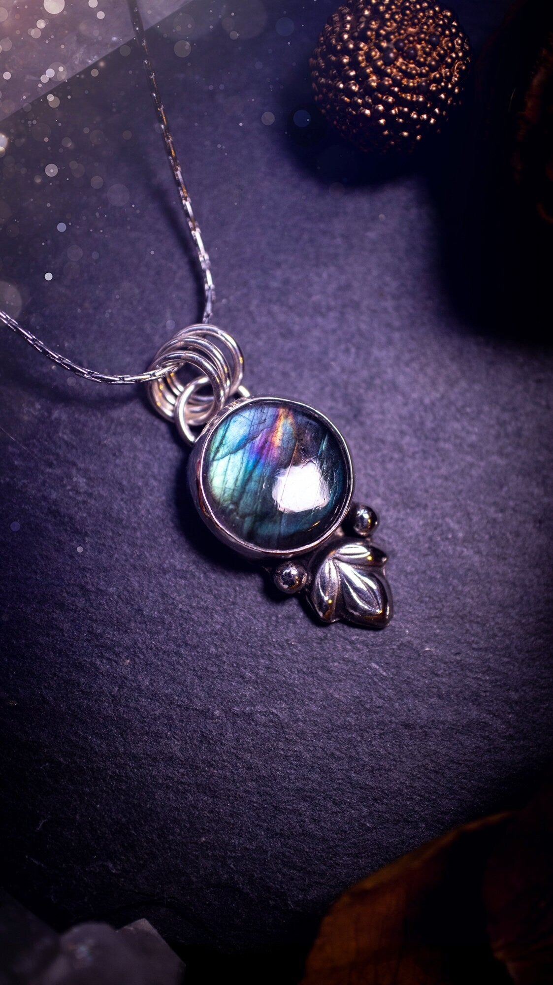 Gorgeous and handmade, sterling silver, purple and green, labradorite spectrolite pendant necklace. This beautiful necklace features a beautiful labradorite crystal full of colour. Handcrafted from sterling silver that has been recycled. Ideal gift.