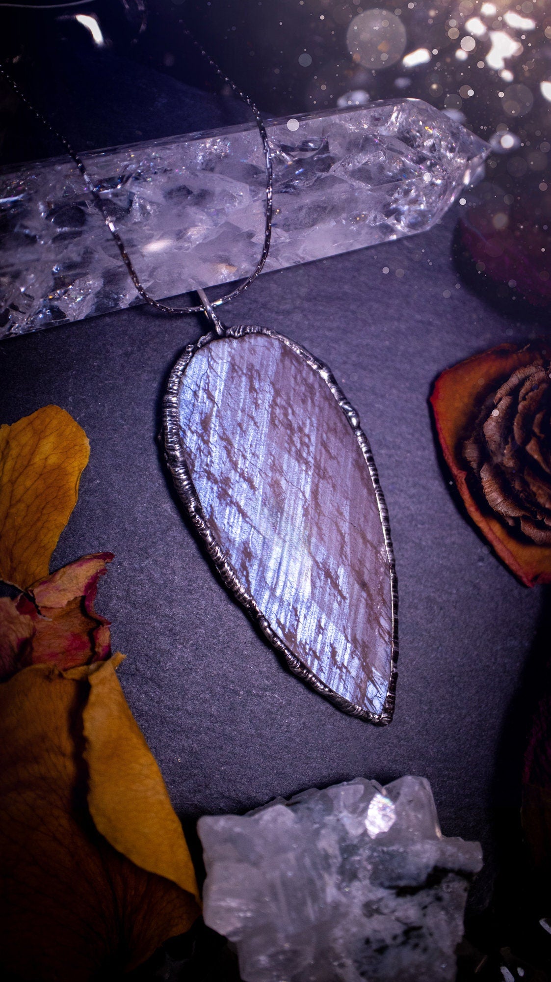 One of a kind, belomorite soft soldered pendant necklace. This pendant has been made using the tiffany technique and is made with lead free solder. The bezel is then polished to a high shine. Ideal gifts for goths, hippies and crystal lovers. Flashy.