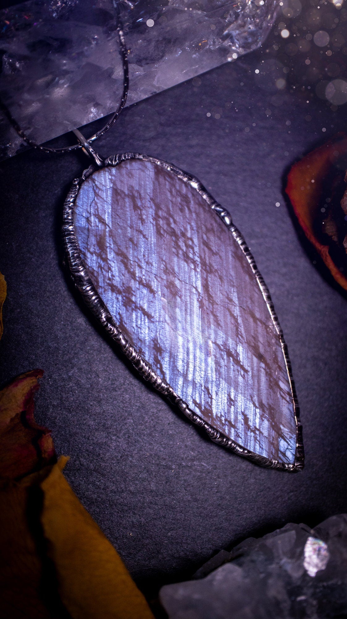 One of a kind, belomorite soft soldered pendant necklace. This pendant has been made using the tiffany technique and is made with lead free solder. The bezel is then polished to a high shine. Ideal gifts for goths, hippies and crystal lovers. Flashy.