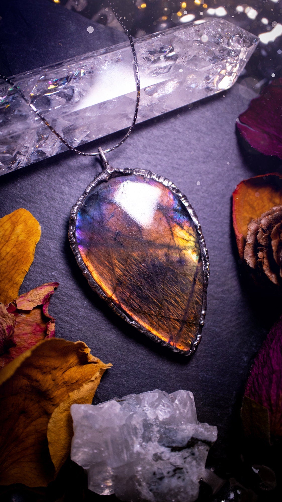 Beautiful, orange, pink and purple labradorite crystal which has been soft soldered to create a stunning pendant. Natural crystal gemstone with lead free solder, a beautiful gift for any crystal lover. This piece of jewellery can be used for healing