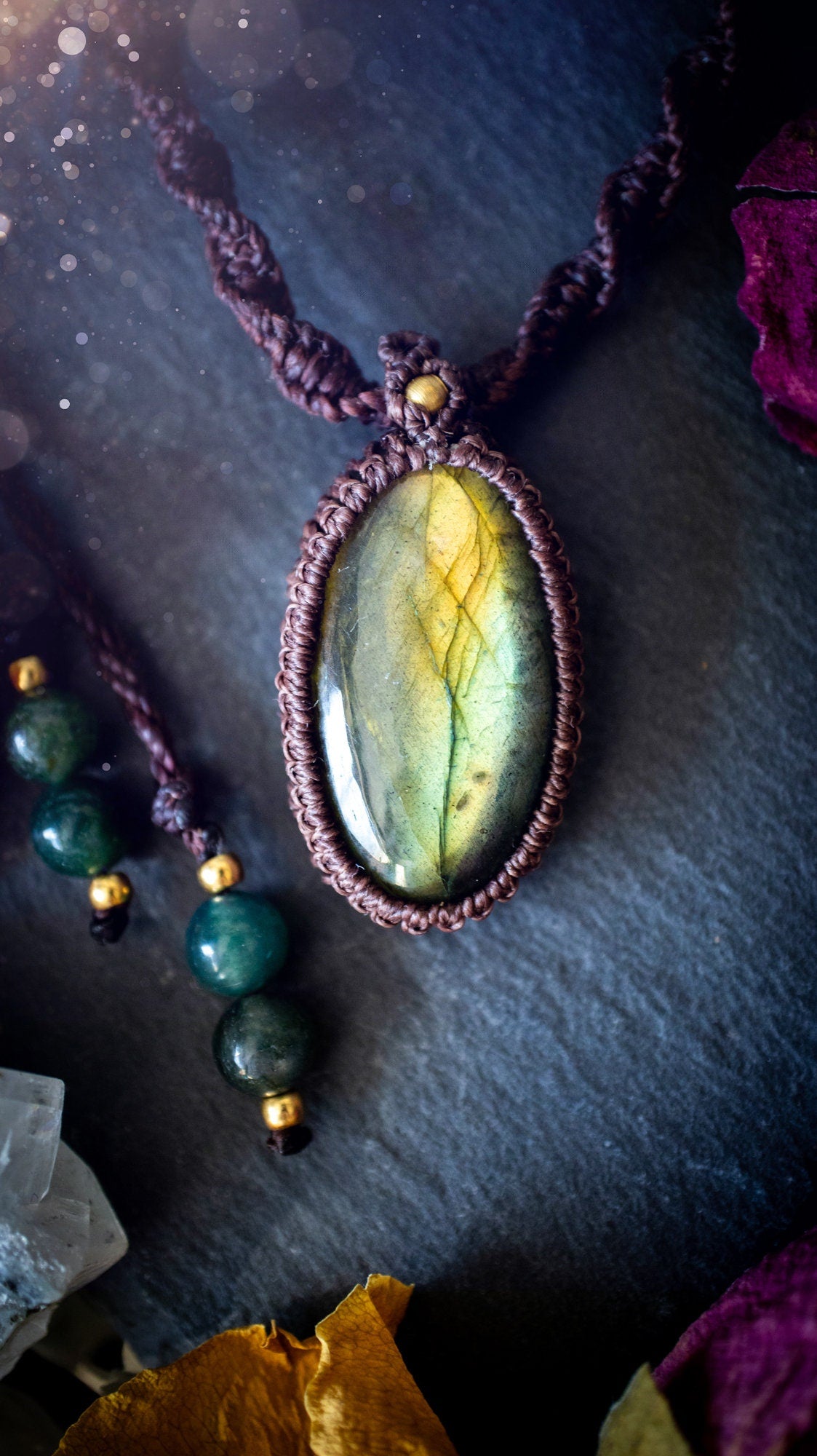 Handmade, autumn green coloured labradorite macrame pendant necklace. Featuring a beautiful labradorite crystal which is full of orange, yellow and purple colours. Crafted with high quality linhastia wax cord, and accents on the necklace. Hippy gifts