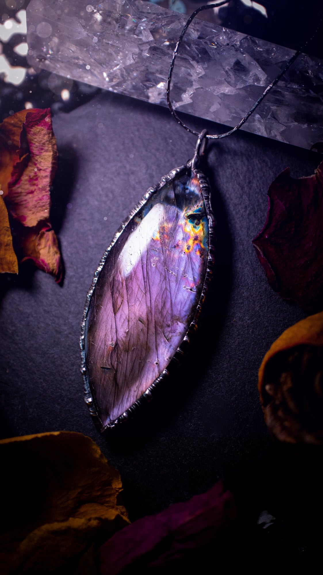 Beautiful, orange, pink and purple labradorite crystal which has been soft soldered to create a stunning pendant. Natural crystal gemstone with lead free solder, a beautiful gift for any crystal lover. This piece of jewellery can be used for healing