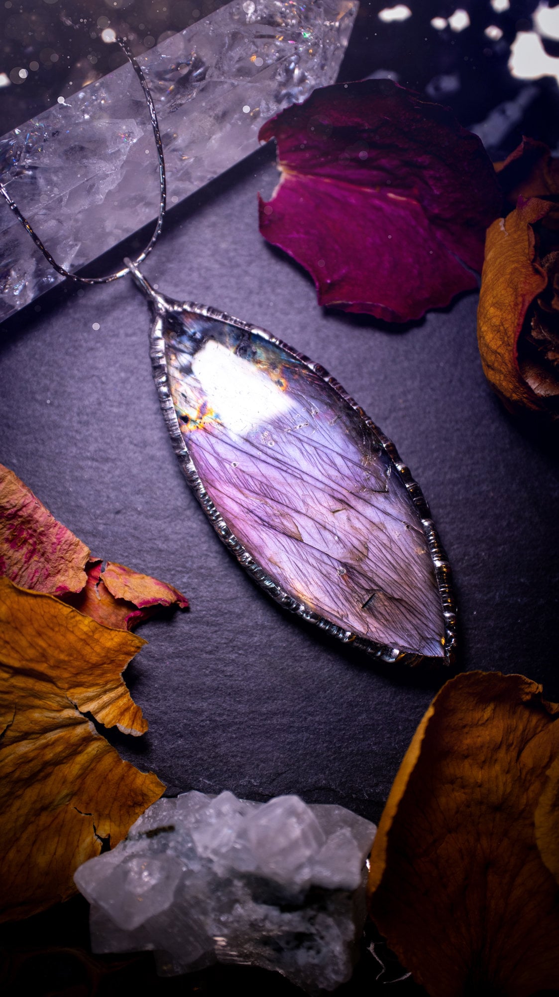 Beautiful, orange, pink and purple labradorite crystal which has been soft soldered to create a stunning pendant. Natural crystal gemstone with lead free solder, a beautiful gift for any crystal lover. This piece of jewellery can be used for healing