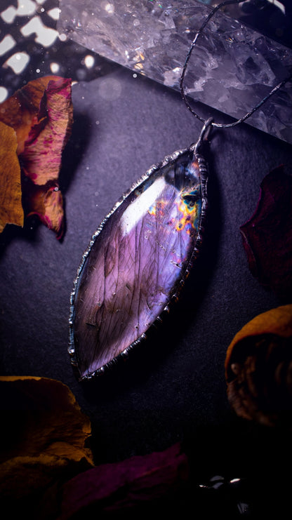 Beautiful, orange, pink and purple labradorite crystal which has been soft soldered to create a stunning pendant. Natural crystal gemstone with lead free solder, a beautiful gift for any crystal lover. This piece of jewellery can be used for healing