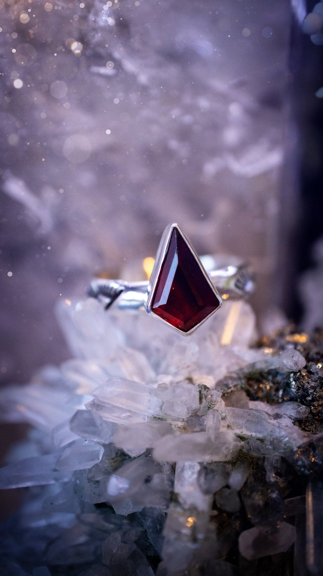 Beautiful and bold, garnet statement ring. Although this ring is dainty, it will certainly make a statement. Featuring a lovely red garnet crystal which is step cut, and mounted in sterling silver on a stamped ring band. Ideal crystal gifts for her