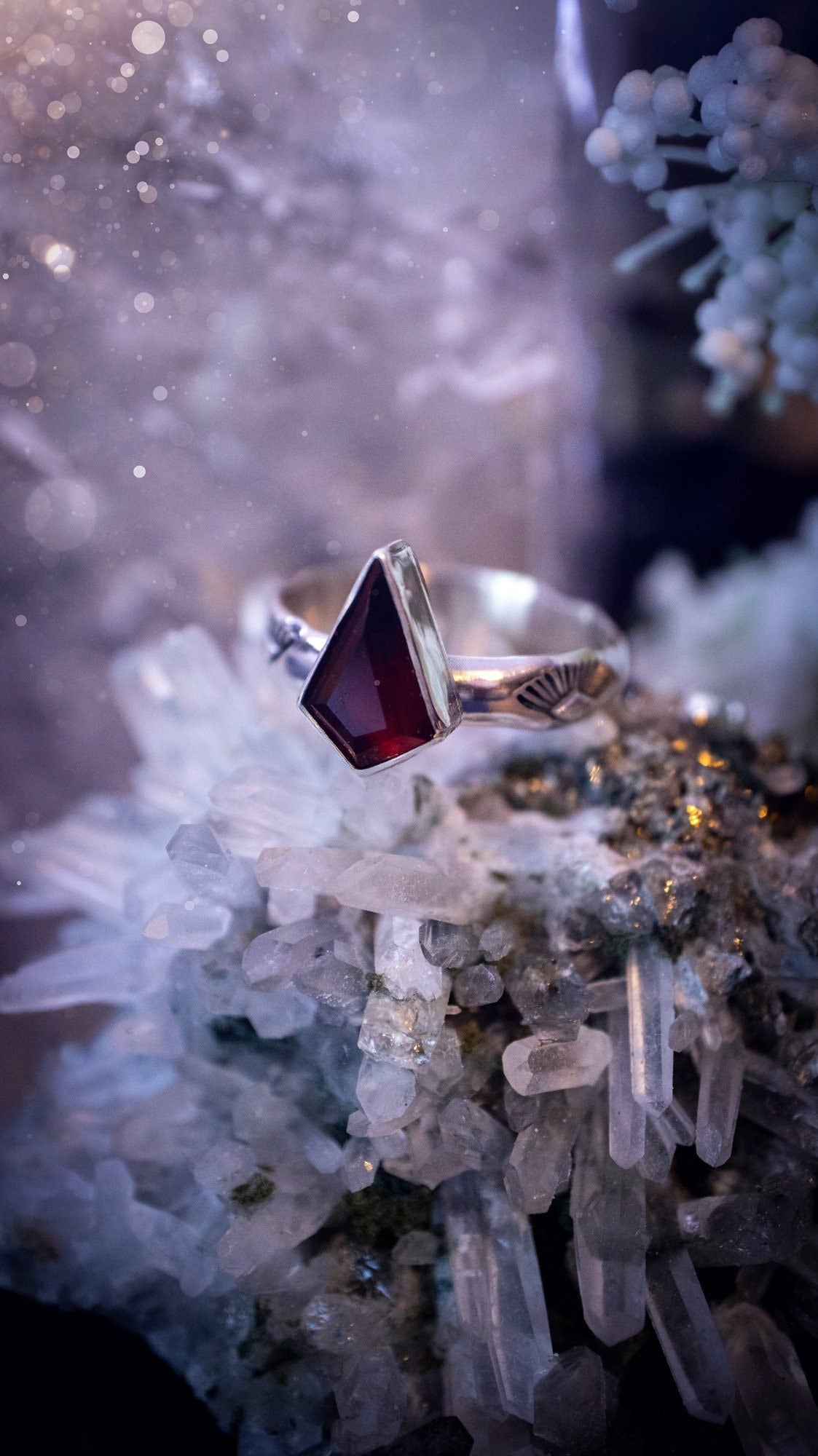 Beautiful and bold, garnet statement ring. Although this ring is dainty, it will certainly make a statement. Featuring a lovely red garnet crystal which is step cut, and mounted in sterling silver on a stamped ring band. Ideal crystal gifts for her