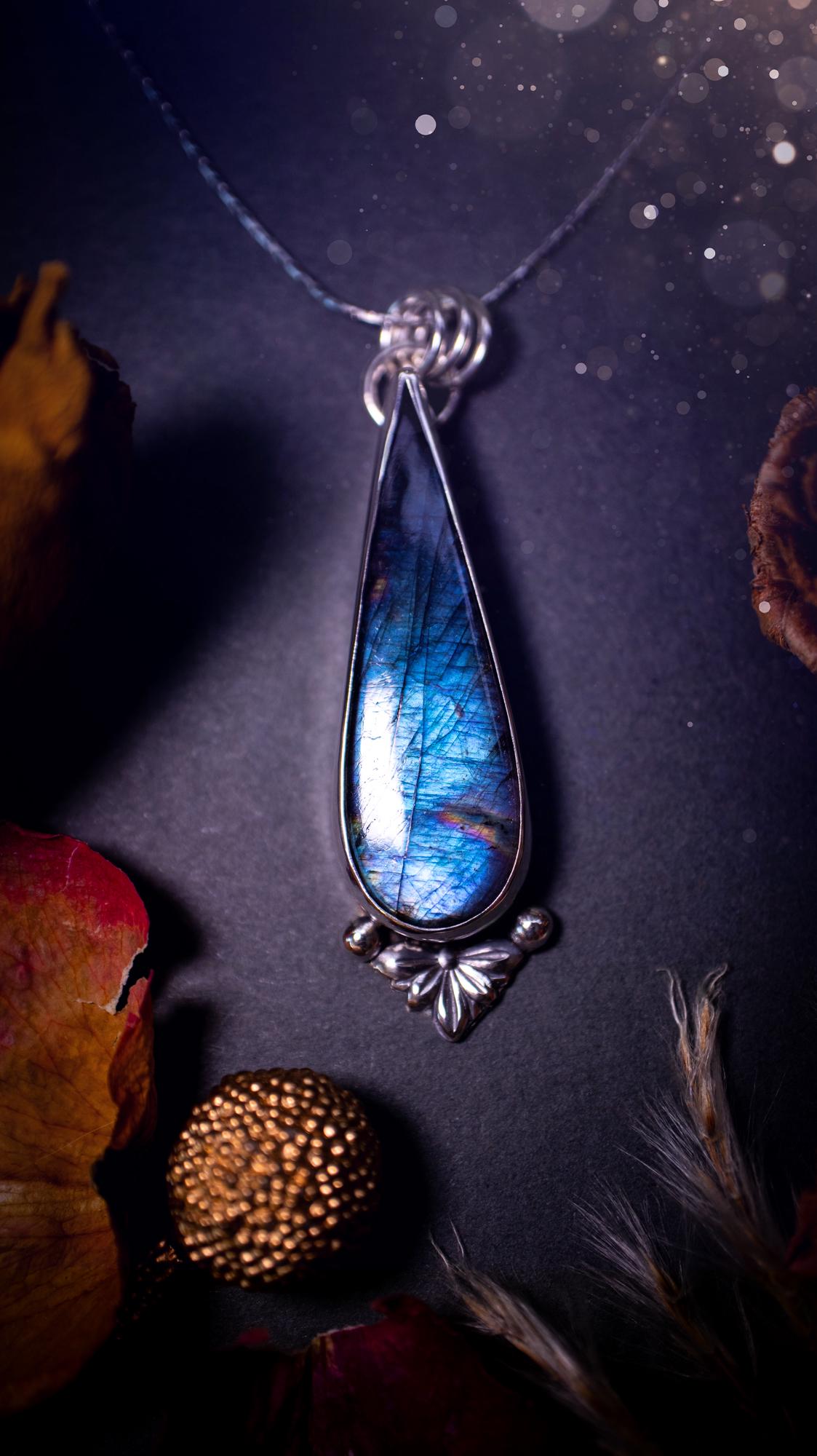 Stunning handcrafted blue and purple spectrolite labradorite pendant necklace. This pendant is very flashy and transitions from blue to purple at different angles. Made from 925 sterling silver with a simple design and silver components. Crystal gift