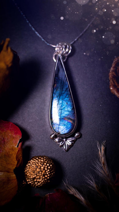 Stunning handcrafted blue and purple spectrolite labradorite pendant necklace. This pendant is very flashy and transitions from blue to purple at different angles. Made from 925 sterling silver with a simple design and silver components. Crystal gift