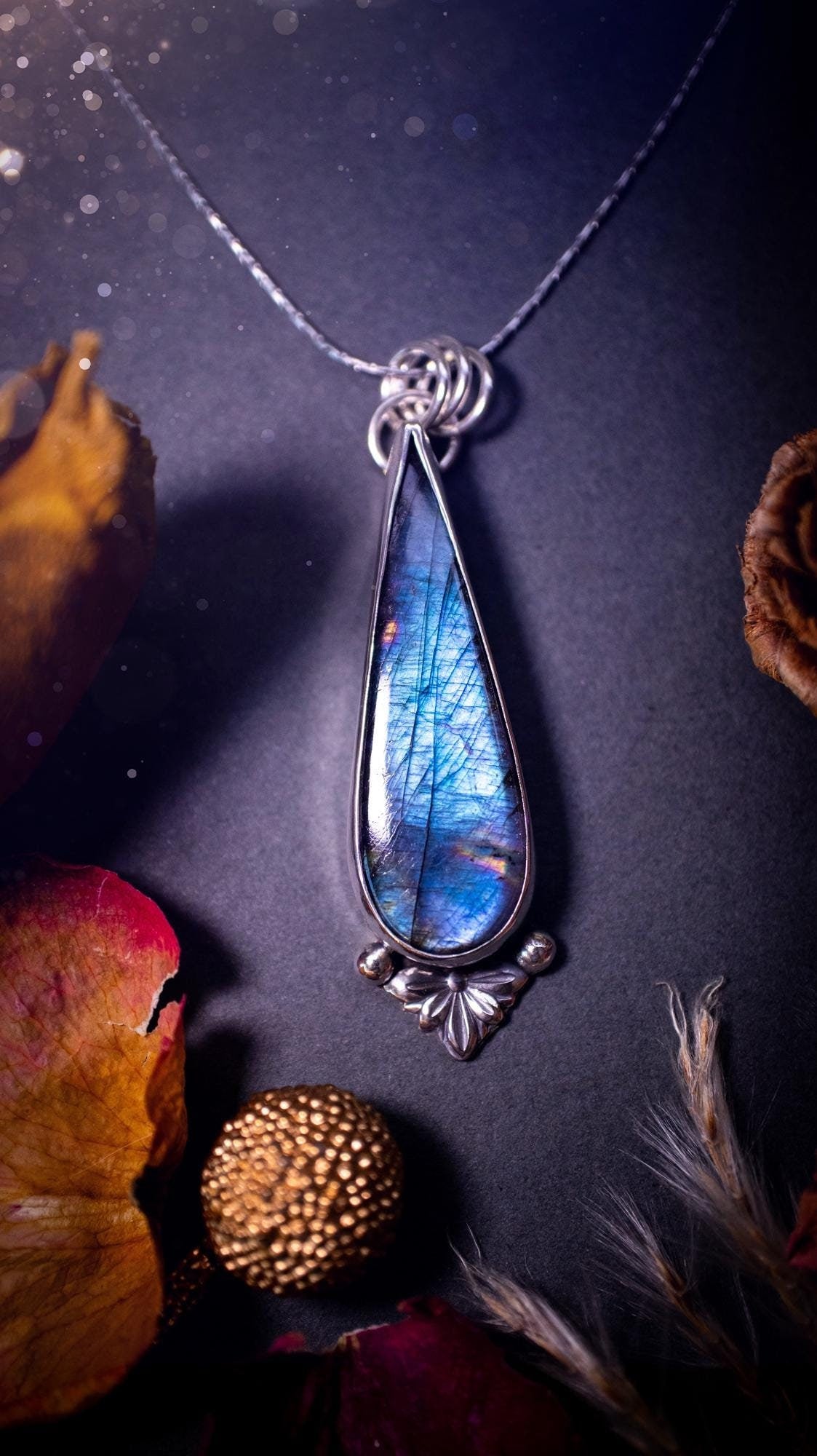 Stunning handcrafted blue and purple spectrolite labradorite pendant necklace. This pendant is very flashy and transitions from blue to purple at different angles. Made from 925 sterling silver with a simple design and silver components. Crystal gift