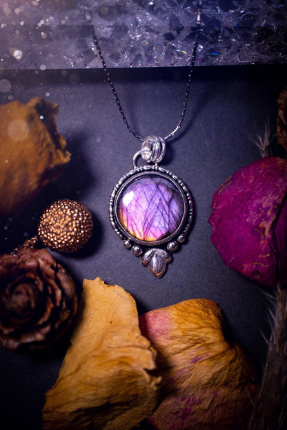 Beautiful and handmade, natural pink, purple and orange labradorite, crystal pendant necklace. This necklace has been made from fine and sterling silver and features silver leaf and ball components. The ideal gift for crystal lovers. Hippy, gothic.