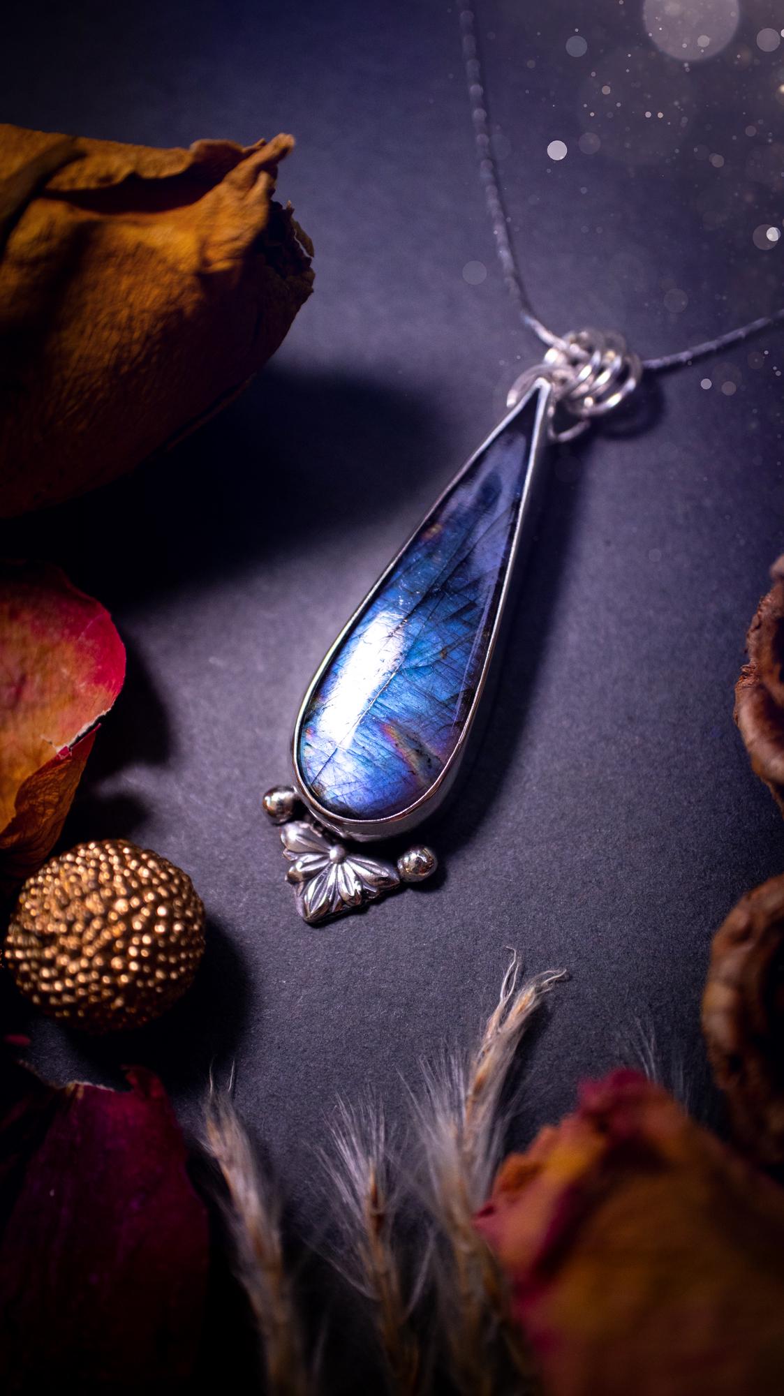 Stunning handcrafted blue and purple spectrolite labradorite pendant necklace. This pendant is very flashy and transitions from blue to purple at different angles. Made from 925 sterling silver with a simple design and silver components. Crystal gift