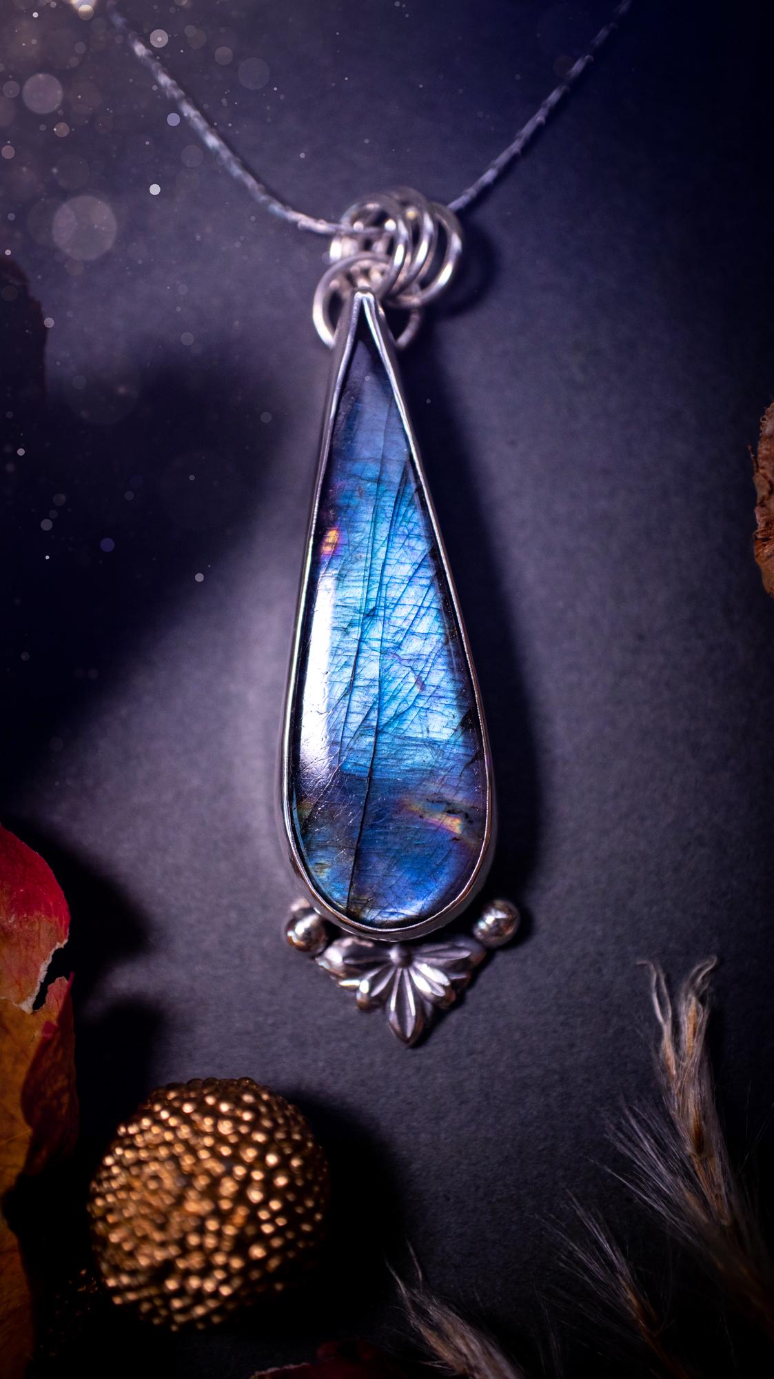 Stunning handcrafted blue and purple spectrolite labradorite pendant necklace. This pendant is very flashy and transitions from blue to purple at different angles. Made from 925 sterling silver with a simple design and silver components. Crystal gift