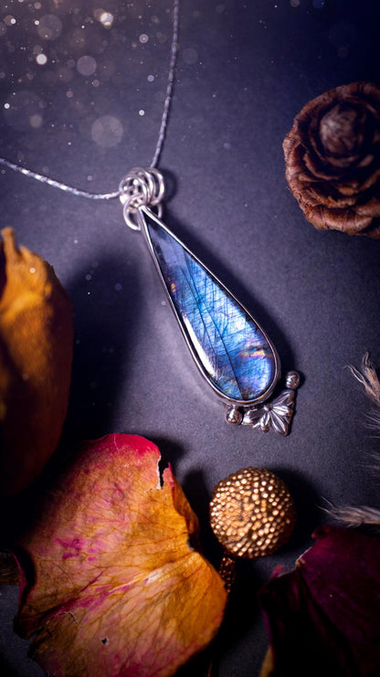 Stunning handcrafted blue and purple spectrolite labradorite pendant necklace. This pendant is very flashy and transitions from blue to purple at different angles. Made from 925 sterling silver with a simple design and silver components. Crystal gift