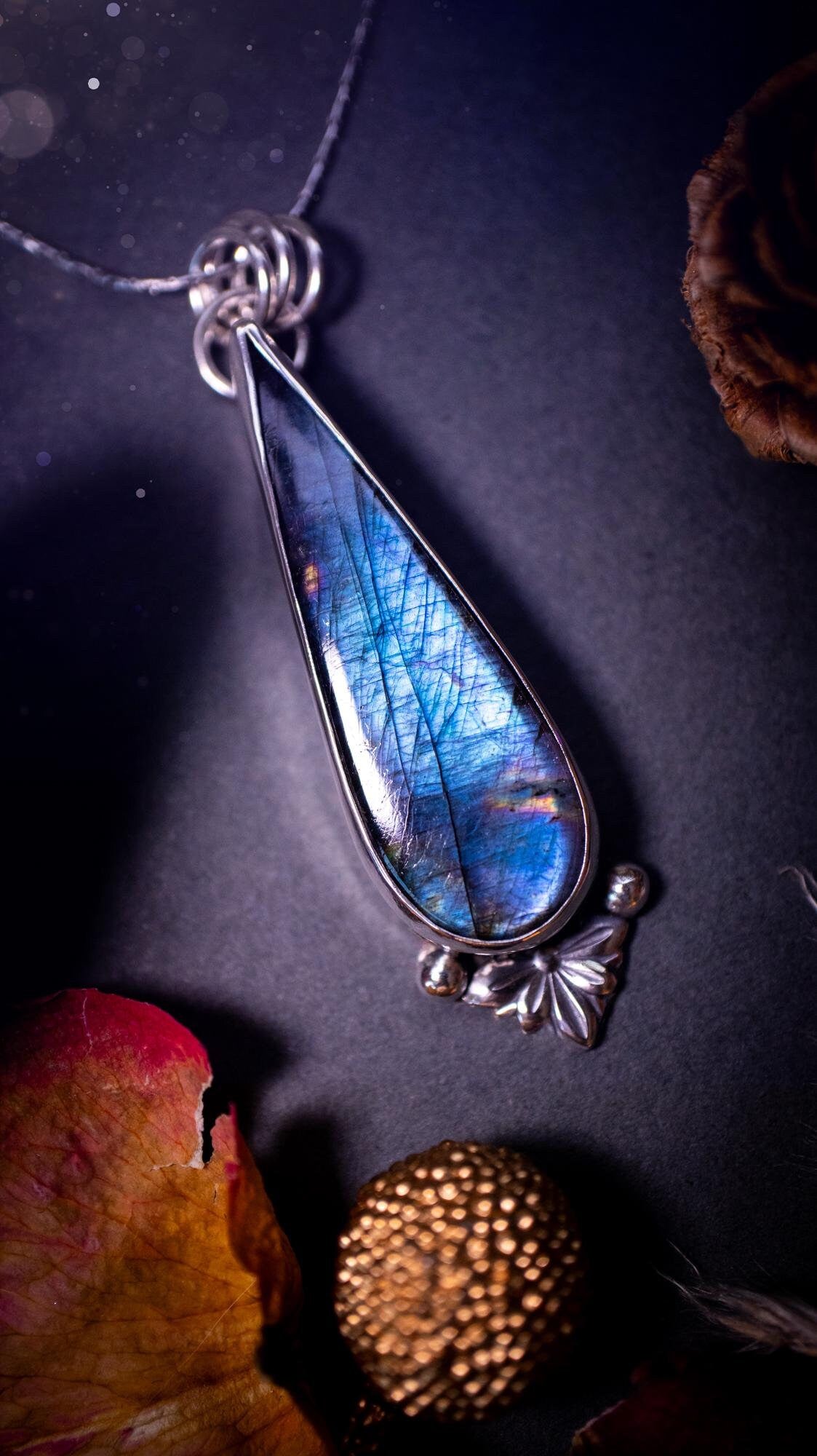 Stunning handcrafted blue and purple spectrolite labradorite pendant necklace. This pendant is very flashy and transitions from blue to purple at different angles. Made from 925 sterling silver with a simple design and silver components. Crystal gift