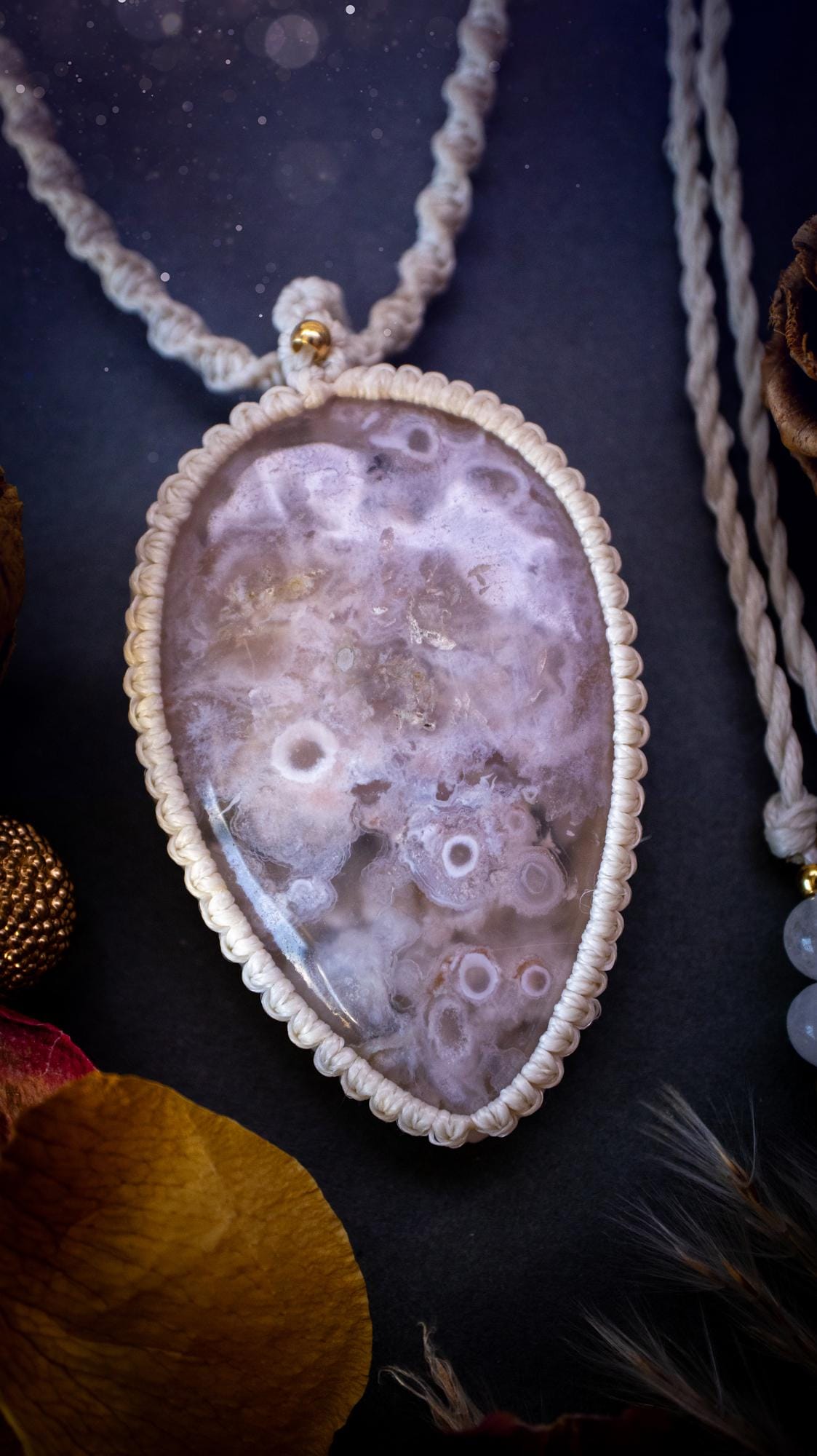 Stunning and large, flower agate macrame pendant necklace. This jewellery piece features a beautiful and large flower agate crystal gemstone. handmade using high quality linhastia waxed cord, completed with jade crystal beads and gold findings. Hippy