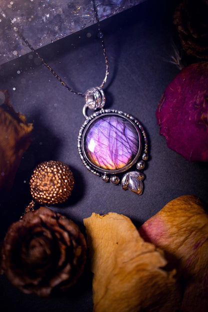 Beautiful and handmade, natural pink, purple and orange labradorite, crystal pendant necklace. This necklace has been made from fine and sterling silver and features silver leaf and ball components. The ideal gift for crystal lovers. Hippy, gothic.