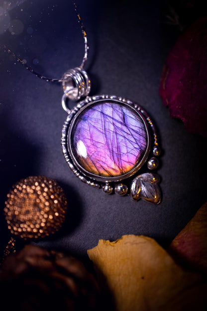 Beautiful and handmade, natural pink, purple and orange labradorite, crystal pendant necklace. This necklace has been made from fine and sterling silver and features silver leaf and ball components. The ideal gift for crystal lovers. Hippy, gothic.