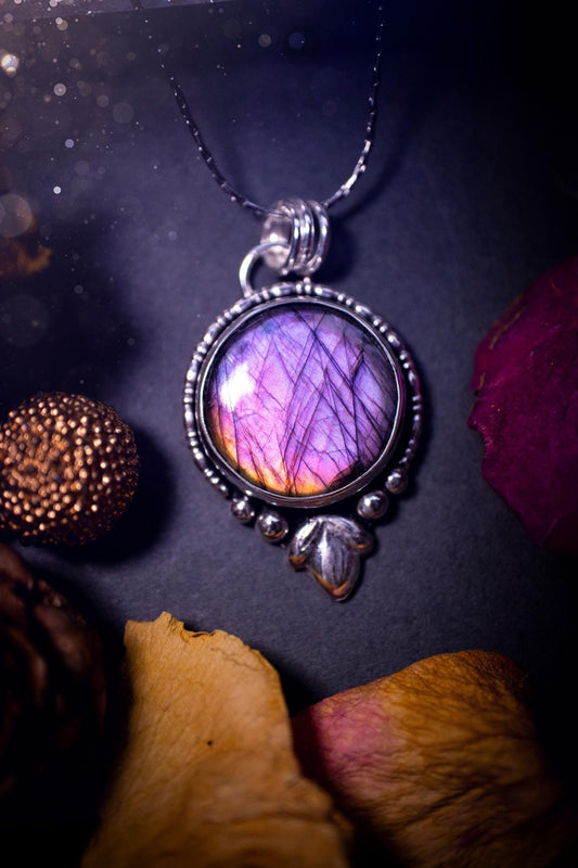 Beautiful and handmade, natural pink, purple and orange labradorite, crystal pendant necklace. This necklace has been made from fine and sterling silver and features silver leaf and ball components. The ideal gift for crystal lovers. Hippy, gothic.