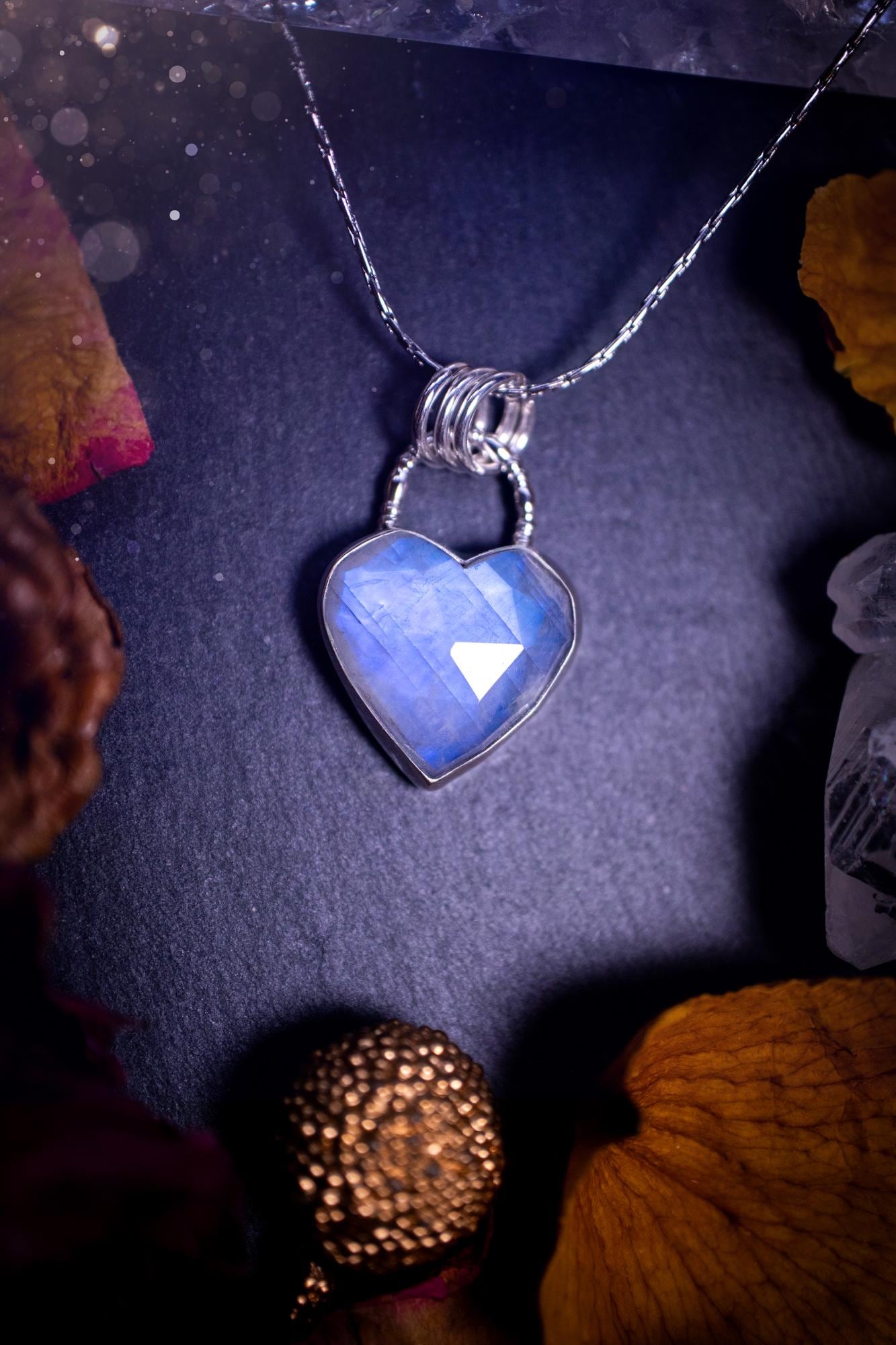 Beautifully handmade, rose cut, rainbow moonstone pendant necklace. This beautiful rainbow moonstone crystal is heart shaped and has a gorgeous flash and sparkle. Made from sterling silver and super dainty. Ideal gift for crystal lovers. Hippy gifts