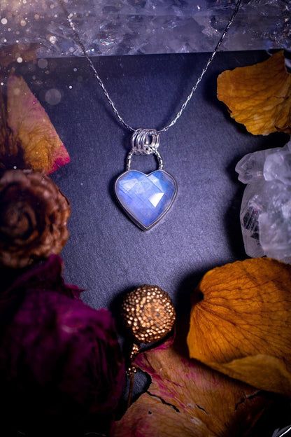 Beautifully handmade, rose cut, rainbow moonstone pendant necklace. This beautiful rainbow moonstone crystal is heart shaped and has a gorgeous flash and sparkle. Made from sterling silver and super dainty. Ideal gift for crystal lovers. Hippy gifts